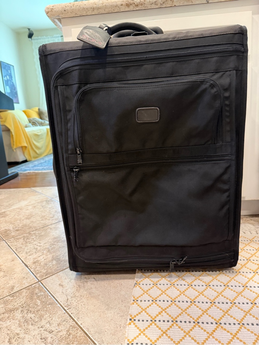 Tumi Black Softside Upright Check in luggage with Front Pockets